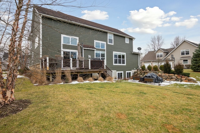 back of house with a yard and a wooden deck