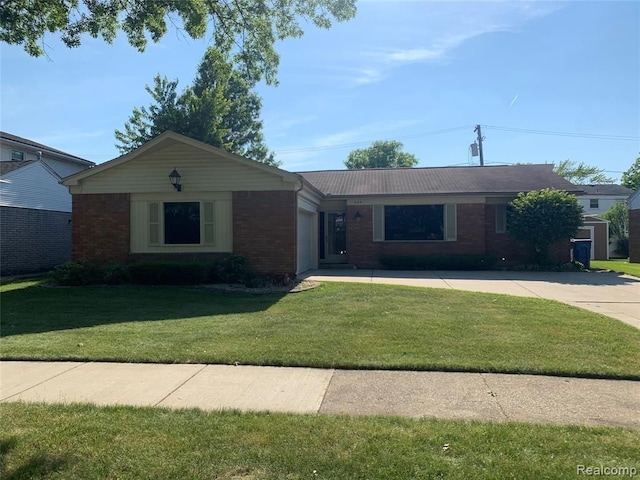 ranch-style home with brick siding, a front lawn, and a garage