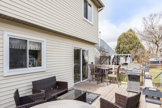 wooden terrace with outdoor dining area