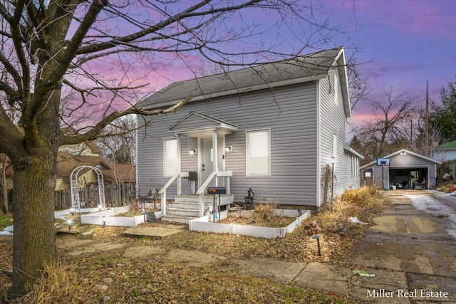 view of front of home featuring an outbuilding