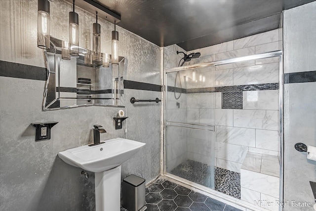 bathroom featuring a stall shower and tile walls