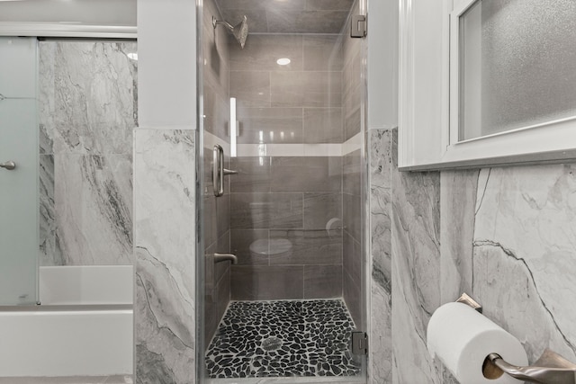 bathroom with a tile shower