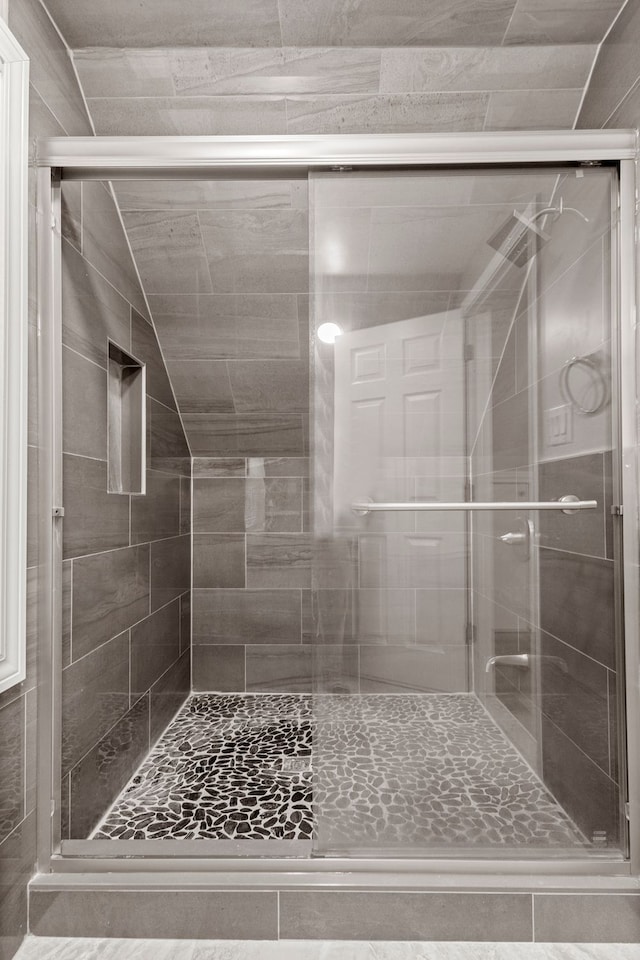 bathroom featuring a stall shower