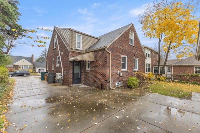 exterior space with brick siding