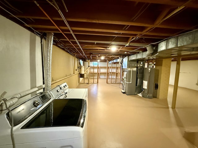 unfinished below grade area featuring heating unit, washing machine and dryer, and water heater