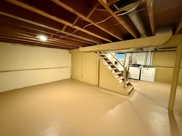 below grade area with washing machine and dryer and stairs