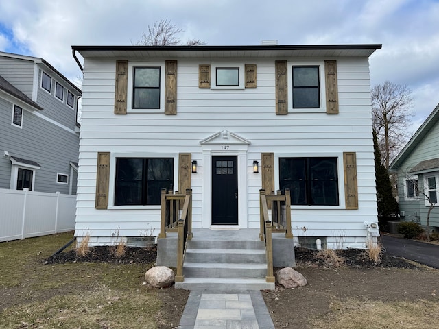 view of front of house with fence