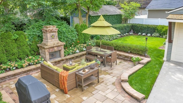 view of patio / terrace featuring outdoor dining space, fence, and an outdoor living space with a fireplace