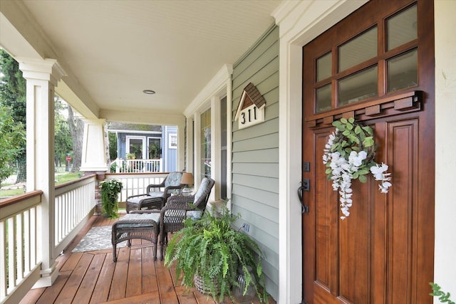 wooden terrace with covered porch