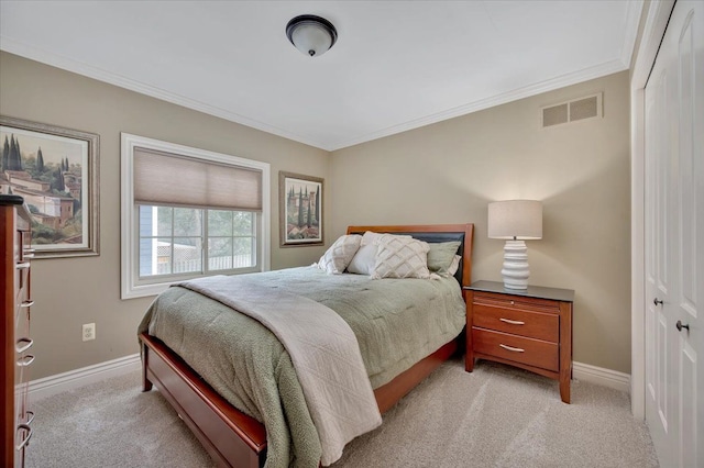 bedroom with light carpet, baseboards, visible vents, and a closet