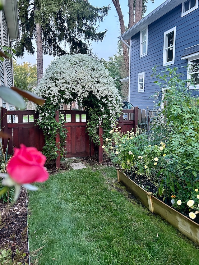 view of yard featuring a garden and fence