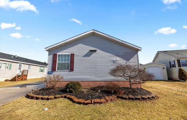 view of property exterior featuring a lawn