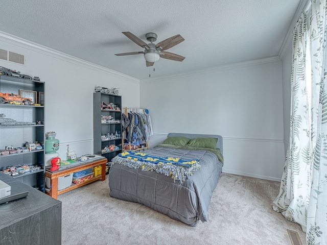 bedroom with carpet floors, a textured ceiling, visible vents, and crown molding