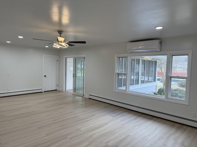 unfurnished room with light wood-type flooring, a baseboard radiator, recessed lighting, and a wall mounted AC