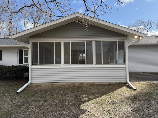 view of side of home with a sunroom