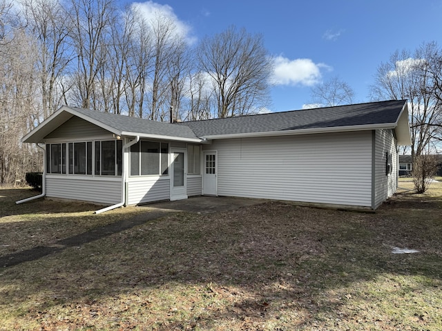 back of property featuring a sunroom