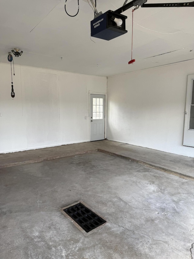 garage with visible vents and a garage door opener