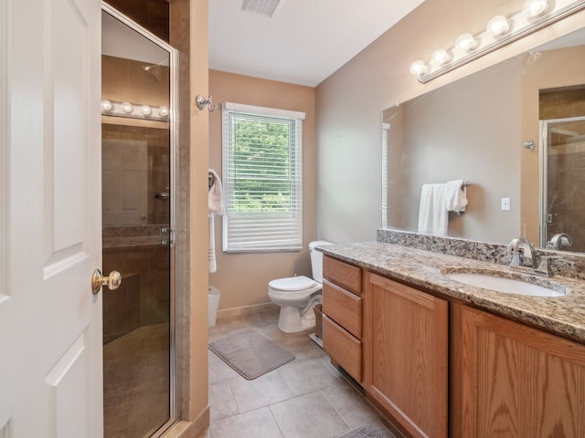 full bathroom featuring a stall shower, visible vents, toilet, tile patterned flooring, and vanity