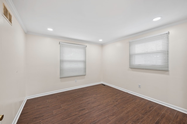 empty room with baseboards, visible vents, ornamental molding, wood finished floors, and recessed lighting