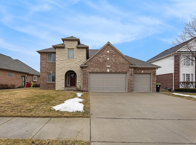 traditional-style home featuring a front lawn, concrete driveway, brick siding, and an attached garage