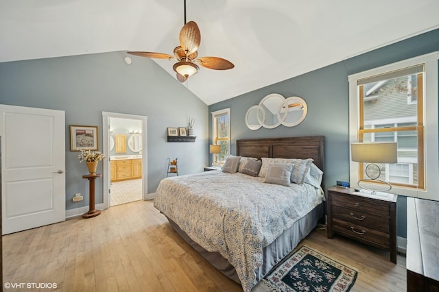 bedroom with vaulted ceiling, ceiling fan, wood-type flooring, and baseboards