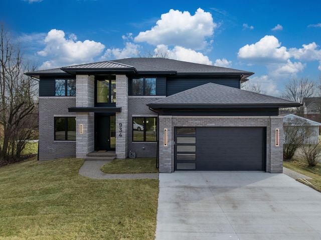 prairie-style house featuring an attached garage, brick siding, a shingled roof, concrete driveway, and a front lawn