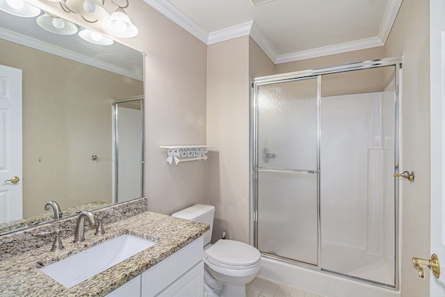 bathroom with toilet, a shower stall, crown molding, and vanity