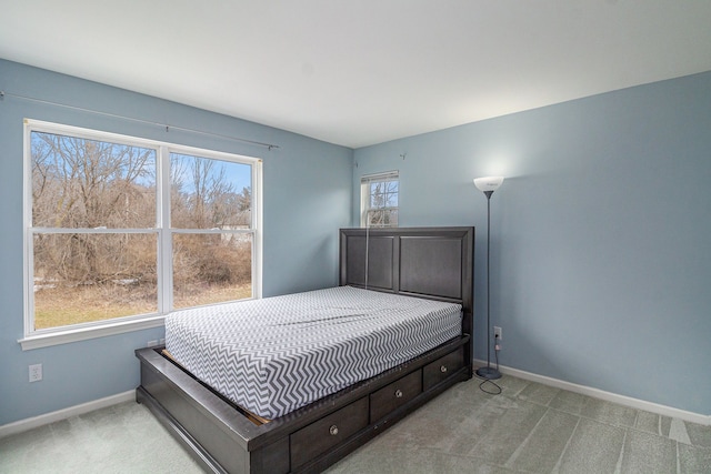 bedroom with carpet floors and baseboards