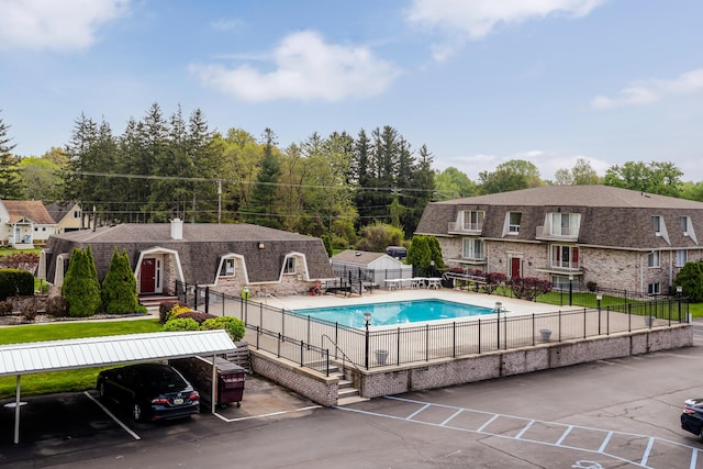 view of pool with a patio area, fence, and a fenced in pool