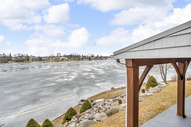 exterior space with a water view