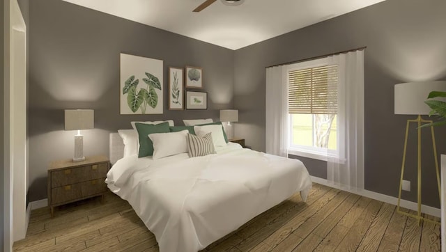 bedroom featuring wood-type flooring and baseboards