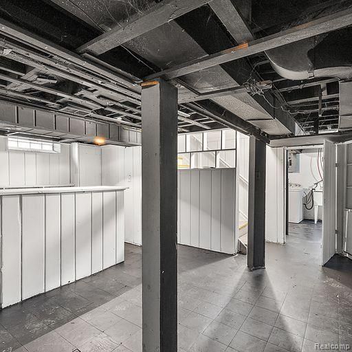 unfinished below grade area with washer / dryer