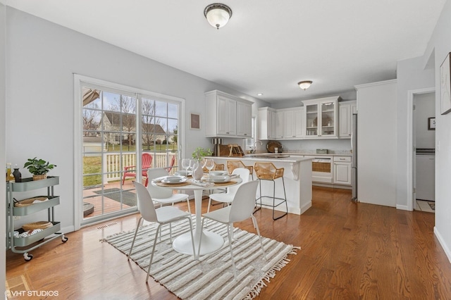 dining room featuring baseboards and wood finished floors