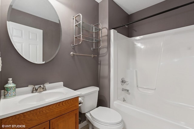 bathroom with  shower combination, vanity, and toilet