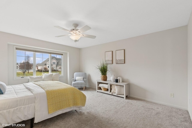 bedroom featuring a ceiling fan, carpet flooring, and baseboards