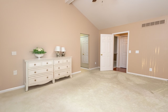 unfurnished bedroom featuring light carpet, baseboards, visible vents, high vaulted ceiling, and beam ceiling