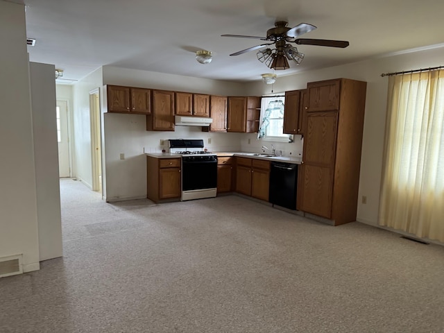 kitchen featuring brown cabinets, gas range gas stove, visible vents, dishwasher, and under cabinet range hood