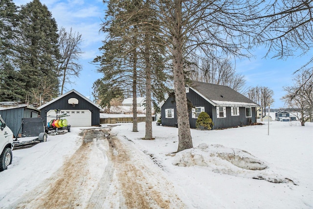 exterior space with an outdoor structure and a detached garage