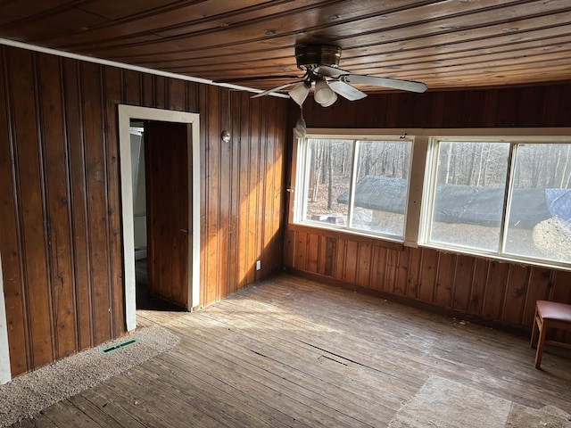 unfurnished sunroom with wood ceiling, visible vents, and ceiling fan