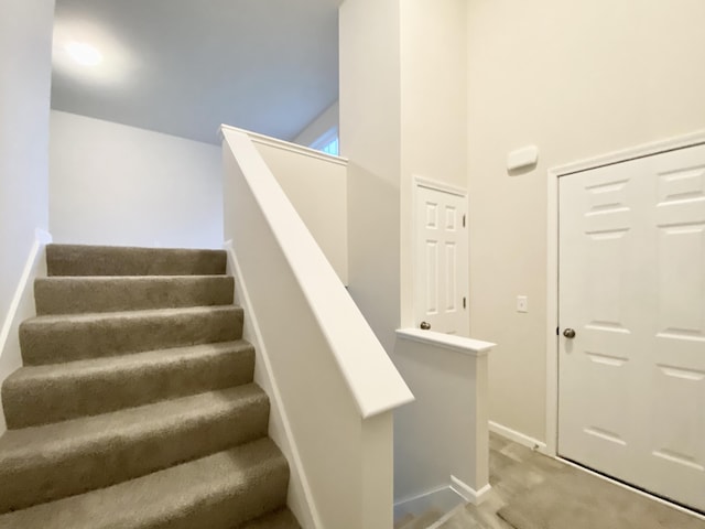 stairway featuring baseboards