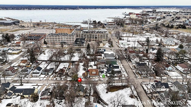 birds eye view of property featuring a water view and a residential view