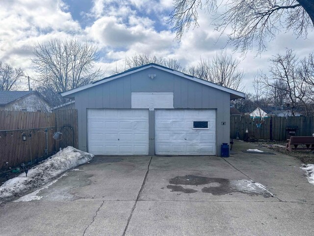 detached garage with fence