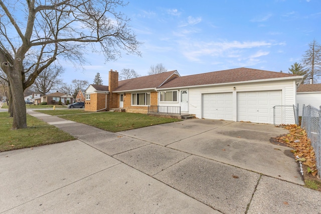 ranch-style home with brick siding, fence, driveway, a chimney, and a front yard