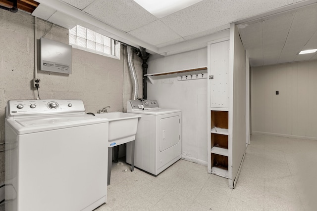 laundry room featuring laundry area, light floors, and washing machine and clothes dryer