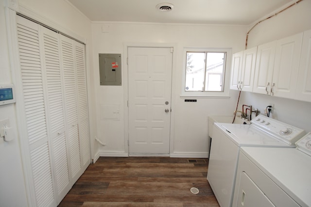 clothes washing area with visible vents, cabinet space, electric panel, dark wood-style floors, and washer and clothes dryer