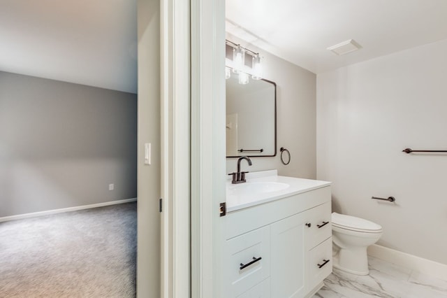 bathroom with marble finish floor, baseboards, vanity, and toilet