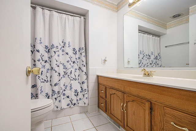 full bathroom featuring toilet, crown molding, visible vents, and tile patterned floors