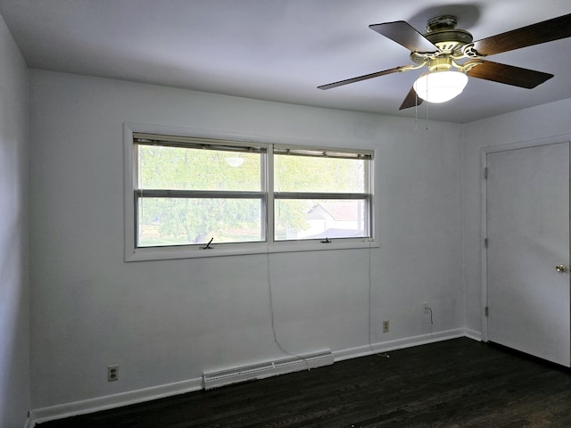 unfurnished room with dark wood-style floors, a baseboard radiator, baseboards, and ceiling fan