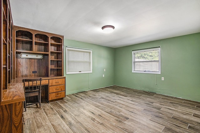 unfurnished office featuring light wood-type flooring