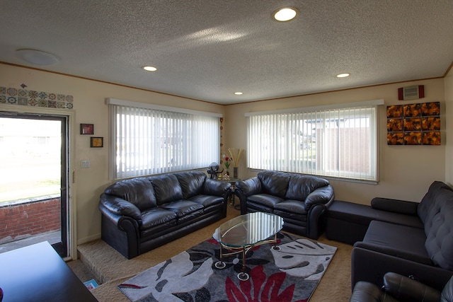carpeted living room with recessed lighting and a textured ceiling